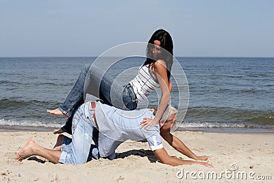 Couple having fun on the beach Stock Photo