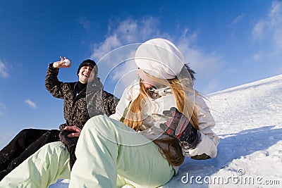 Couple having fun on snowboard Stock Photo