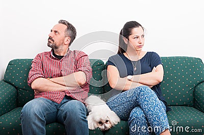 Couple having a quarrel while sitting on sofa Stock Photo