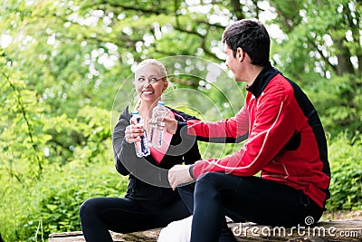Couple having rest during jogging sport Stock Photo