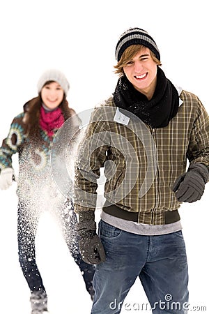Couple having snowball fight Stock Photo