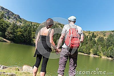 Couple on hike hand in hand Stock Photo