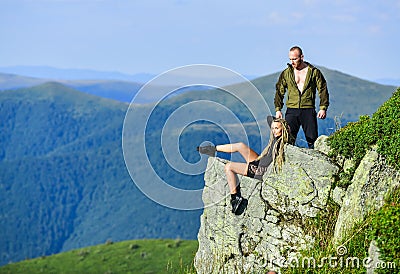 Couple hikers enjoy view. Hiking peaceful moment. Tourist hiker girl and man relaxing. Hiking benefits. Hiking weekend Stock Photo