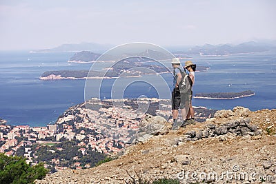 Couple Hikers Looking At Great Seascape Editorial Stock Photo