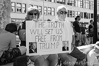 Older Couple Hold an Anti Trump Protest Sign at a Demonstration Against President Donald Trump Editorial Stock Photo