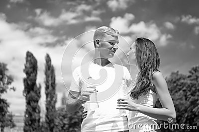 Couple hold water bottles. Water balance concept. Signs you definitely need pay attention body hydration. Sport and Stock Photo