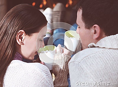 Couple holding cups with hot chocolate with marshmallows Stock Photo