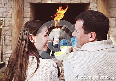 Couple holding cups with hot chocolate with marshmallows Stock Photo