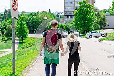 Couple Holding Hands Walking Away Stock Photo