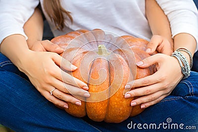 Couple holding a pumpkin Stock Photo