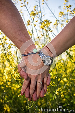 Couple holding their hands. Engagement ring Stock Photo