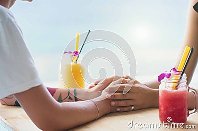 The couple holding there hands Stock Photo