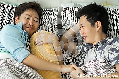 Couple Homosexuality relax on bed in bedroom Stock Photo