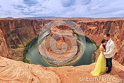 A couple on a honeymoon road trip at Horseshoe Bend, Arizona Stock Photo