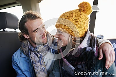 Couple, hug and happy together in car, travel and bonding with road trip for date or anniversary. Love, trust and Stock Photo