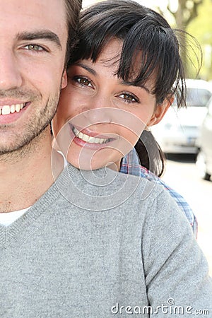Couple hugging in the street Stock Photo