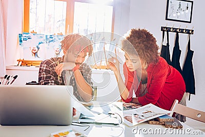 Couple of interior designers feeling excited having serious project Stock Photo