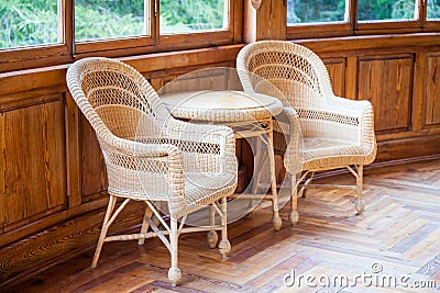 This couple of Italian wickler chairs with table are part of the original furniture 1910-1920 of a semi-abandoned villa owned Stock Photo