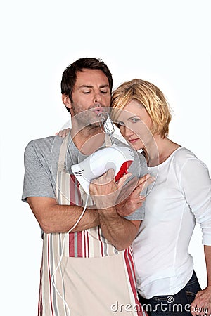 A couple jesting in kitchen Stock Photo