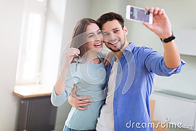 Couple with keys to new home Stock Photo