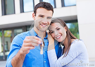 Couple with keys to new home Stock Photo