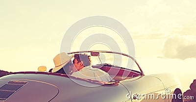 Couple Kissing in Classic Vintage Sports Car Stock Photo