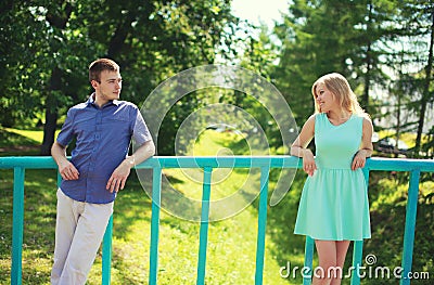 Couple looking at each other on the distance - love, relationships, dating and flirting Stock Photo