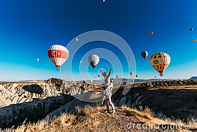 Couple in love among the balloons meets the sun Stock Photo