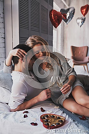 Couple in love. Beautiful young couple drinking champagne and s Stock Photo