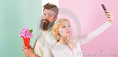 Couple in love bouquet dating celebrate anniversary relations. Sharing happy selfie. Woman capturing happy moment Stock Photo