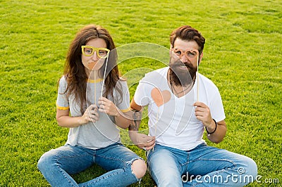 Couple in love cheerful youth booth props. Emotional people. Couple dating. Carefree couple having fun green lawn. Man Stock Photo