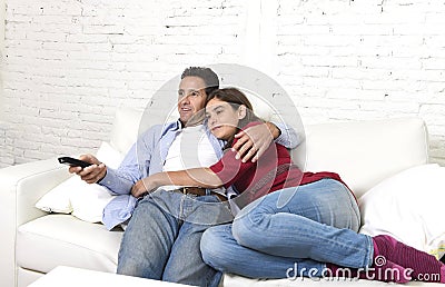 https://thumbs.dreamstime.com/x/couple-love-cuddling-home-couch-relaxing-watching-movie-television-man-holding-remote-control-young-attractive-61343126.jpg