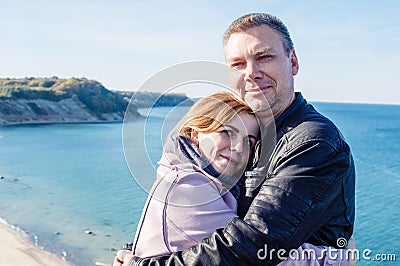 Couple in love cuddling on a seaside Stock Photo