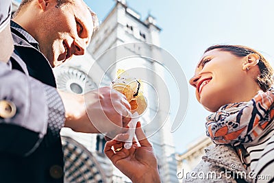 A couple in love eat ice-cream during their Italian voyage Stock Photo
