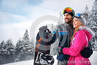 Couple enjoy skiing on mountain Stock Photo