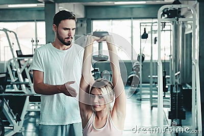 Couple Love Exercising Workout in Fitness Training Room, Young Couple Caucasian Working Out and Exercise Training Together With Stock Photo