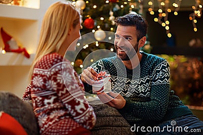 Couple in love giving gift Christmas to each other Stock Photo