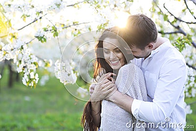 Couple in love kissing and hugging in spring park Stock Photo