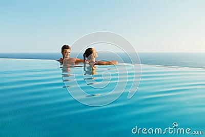 Couple In Love In Luxury Resort Pool On Romantic Summer Vacation Stock Photo