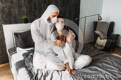 A couple in love quarantined at home. The couple stayed at home during the epidemic. Stock Photo