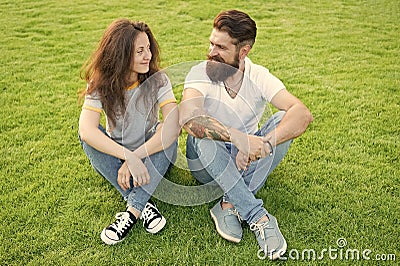 Couple in love relaxing on green lawn. Playful girlfriend and boyfriend dating. Lovely couple outdoors. Soulmates Stock Photo