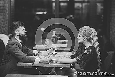 Couple in love. Romantic couple dating in pub at night. Stock Photo