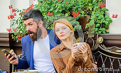 Couple in love sit cafe terrace enjoy coffee while man speak phone. Girl dating with businessman. Things know before you Stock Photo