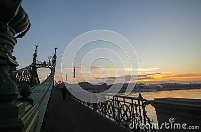 Couple in love is standing on the liberty bridge over the river Danube in Budapest. Sunrise in the big city. Dark silhouettes of Editorial Stock Photo