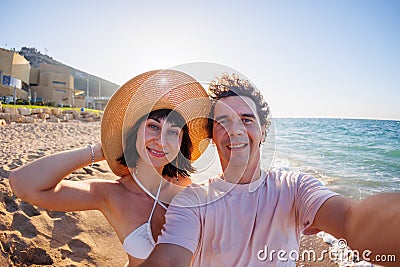 couple in love takes a selfie on the phone. selfie on the beach on a sunny summer day Stock Photo