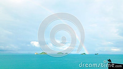 Couple lover cute little birds love rainbow on sky, sea, ocean Stock Photo