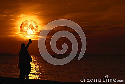 Couple lover selfie with full Sturgeon on sea and reflection moonlight on water surface Stock Photo