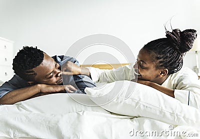 A couple lying in bed together Stock Photo