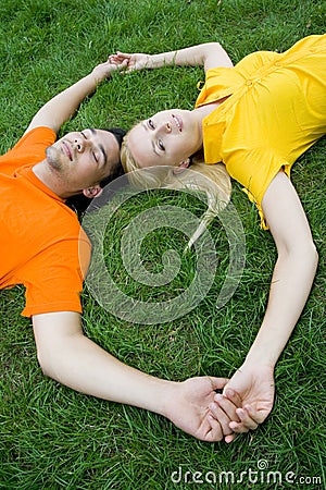 Couple lying on grass Stock Photo