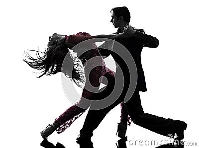 Couple man woman ballroom dancers tangoing silhouette Stock Photo